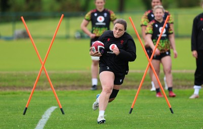 140526 - Wales Women Rugby Training - Jenni Scoble warms up during a rugby training session ahead of their final Women’s 6 Nations match against Italy