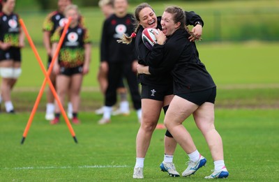 140526 - Wales Women Rugby Training - Jenni Scoble and Elan Jones warm up during a rugby training session ahead of their final Women’s 6 Nations match against Italy