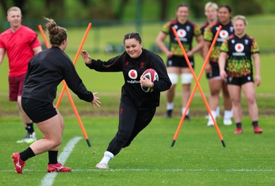 140526 - Wales Women Rugby Training - Jorja Aiono warms up during a rugby training session ahead of their final Women’s 6 Nations match against Italy