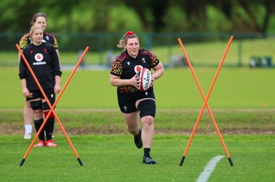 140526 - Wales Women Rugby Training - Gwenllian Pyrs warms up during a rugby training session ahead of their final Women’s 6 Nations match against Italy
