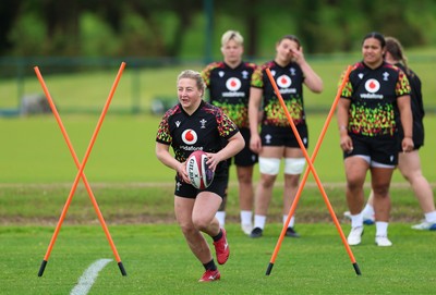 140526 - Wales Women Rugby Training - Molly Reardon warms up during a rugby training session ahead of their final Women’s 6 Nations match against Italy