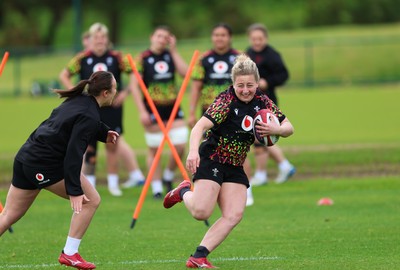 140526 - Wales Women Rugby Training - Molly Reardon warms up during a rugby training session ahead of their final Women’s 6 Nations match against Italy