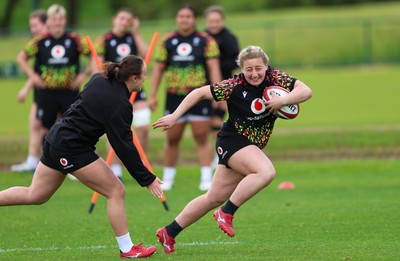 140526 - Wales Women Rugby Training - Molly Reardon warms up during a rugby training session ahead of their final Women’s 6 Nations match against Italy