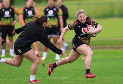 140526 - Wales Women Rugby Training - Molly Reardon warms up during a rugby training session ahead of their final Women’s 6 Nations match against Italy