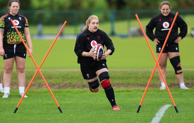 140526 - Wales Women Rugby Training - Bethan Lewis warms up during a rugby training session ahead of their final Women’s 6 Nations match against Italy