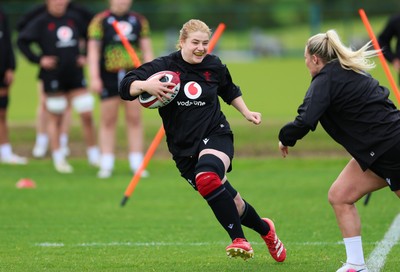 140526 - Wales Women Rugby Training - Bethan Lewis warms up during a rugby training session ahead of their final Women’s 6 Nations match against Italy