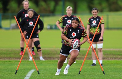 140526 - Wales Women Rugby Training - Sisilia Tuipulotu warms up during a rugby training session ahead of their final Women’s 6 Nations match against Italy