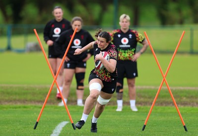 140526 - Wales Women Rugby Training - Branwen Metcalfe warms up during a rugby training session ahead of their final Women’s 6 Nations match against Italy