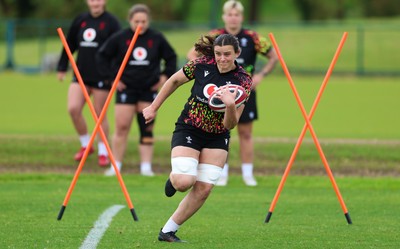 140526 - Wales Women Rugby Training - Branwen Metcalfe warms up during a rugby training session ahead of their final Women’s 6 Nations match against Italy