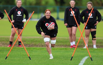 140526 - Wales Women Rugby Training - Georgia Evans warms up during a rugby training session ahead of their final Women’s 6 Nations match against Italy
