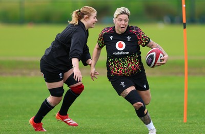 140526 - Wales Women Rugby Training - Donna Rose warms up during a rugby training session ahead of their final Women’s 6 Nations match against Italy