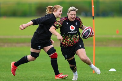 140526 - Wales Women Rugby Training - Donna Rose warms up during a rugby training session ahead of their final Women’s 6 Nations match against Italy