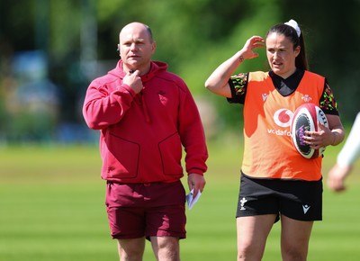 140526 - Wales Women Rugby Training - Sean Lynn, Wales Women head coach and Kayleigh Powell during a rugby training session ahead of their final Women’s 6 Nations match against Italy