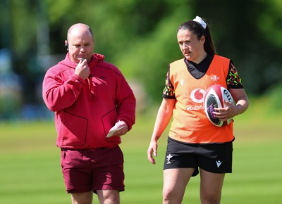 140526 - Wales Women Rugby Training - Sean Lynn, Wales Women head coach and Kayleigh Powell during a rugby training session ahead of their final Women’s 6 Nations match against Italy