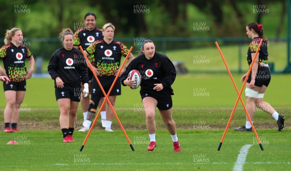140526 - Wales Women Rugby Training - Kendall Waudby warms up during a rugby training session ahead of their final Women’s 6 Nations match against Italy