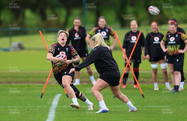 140526 - Wales Women Rugby Training - Donna Rose warms up during a rugby training session ahead of their final Women’s 6 Nations match against Italy