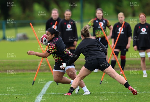 140526 - Wales Women Rugby Training - Sisilia Tuipulotu warms up during a rugby training session ahead of their final Women’s 6 Nations match against Italy