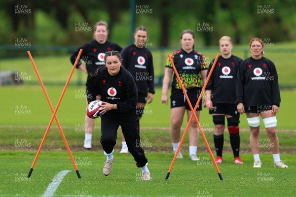140526 - Wales Women Rugby Training - Jorja Aiono warms up during a rugby training session ahead of their final Women’s 6 Nations match against Italy