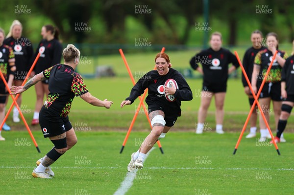 140526 - Wales Women Rugby Training - Georgia Evans warms up during a rugby training session ahead of their final Women’s 6 Nations match against Italy