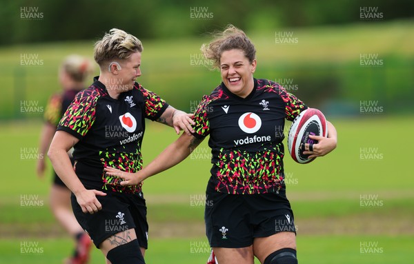 140526 - Wales Women Rugby Training - Natalia John and Donna Rose warm up during a rugby training session ahead of their final Women’s 6 Nations match against Italy