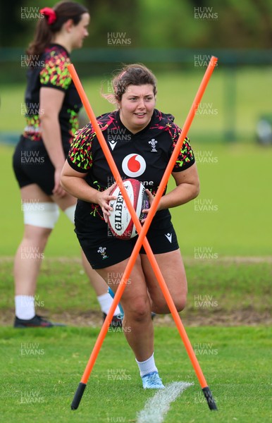 140526 - Wales Women Rugby Training - Stella Orrin warms up during a rugby training session ahead of their final Women’s 6 Nations match against Italy