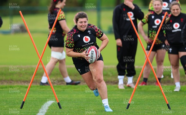 140526 - Wales Women Rugby Training - Stella Orrin warms up during a rugby training session ahead of their final Women’s 6 Nations match against Italy