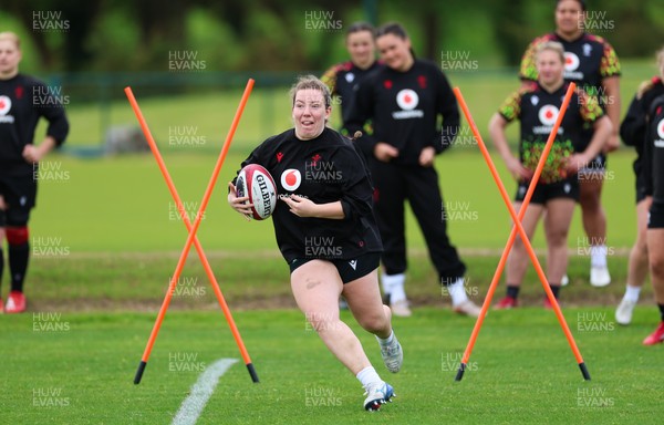 140526 - Wales Women Rugby Training - Elan Jones warms up during a rugby training session ahead of their final Women’s 6 Nations match against Italy