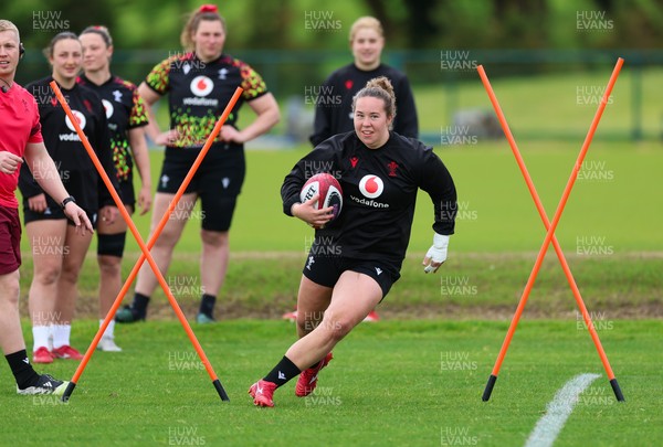 140526 - Wales Women Rugby Training - Katherine Baverstock warms up during a rugby training session ahead of their final Women’s 6 Nations match against Italy