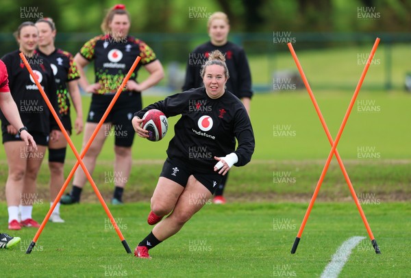 140526 - Wales Women Rugby Training - Katherine Baverstock warms up during a rugby training session ahead of their final Women’s 6 Nations match against Italy