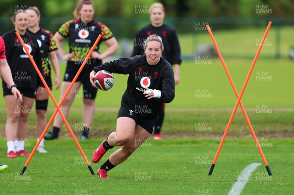 140526 - Wales Women Rugby Training - Katherine Baverstock warms up during a rugby training session ahead of their final Women’s 6 Nations match against Italy