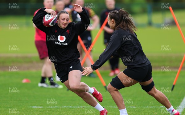 140526 - Wales Women Rugby Training - Kendall Waudby warms up during a rugby training session ahead of their final Women’s 6 Nations match against Italy
