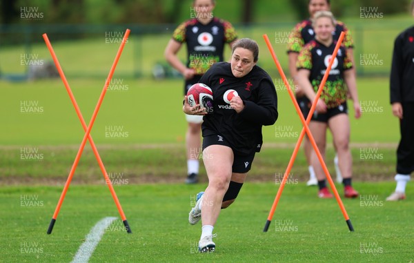 140526 - Wales Women Rugby Training - Jenni Scoble warms up during a rugby training session ahead of their final Women’s 6 Nations match against Italy