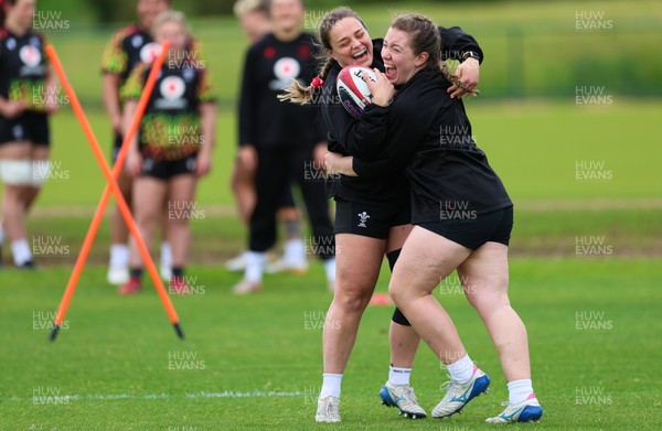 140526 - Wales Women Rugby Training - Jenni Scoble and Elan Jones warm up during a rugby training session ahead of their final Women’s 6 Nations match against Italy