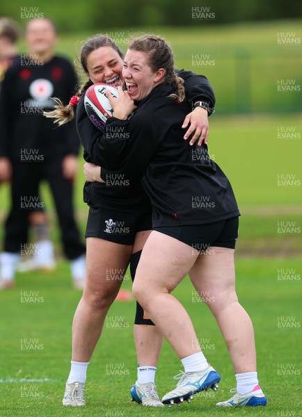 140526 - Wales Women Rugby Training - Jenni Scoble and Elan Jones warm up during a rugby training session ahead of their final Women’s 6 Nations match against Italy