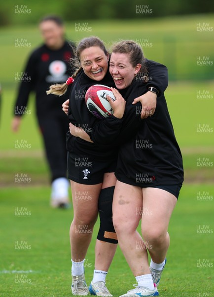 140526 - Wales Women Rugby Training - Jenni Scoble and Elan Jones warm up during a rugby training session ahead of their final Women’s 6 Nations match against Italy