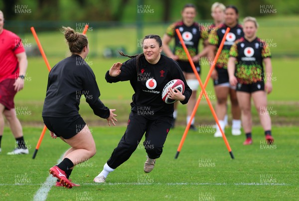 140526 - Wales Women Rugby Training - Jorja Aiono warms up during a rugby training session ahead of their final Women’s 6 Nations match against Italy
