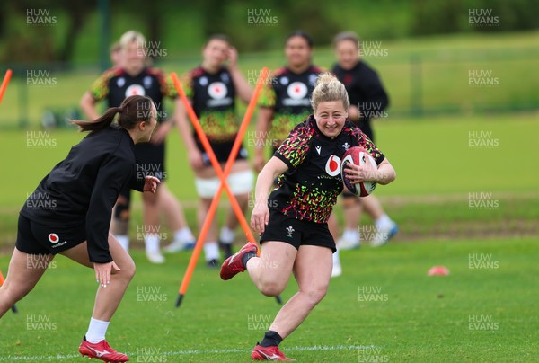 140526 - Wales Women Rugby Training - Molly Reardon warms up during a rugby training session ahead of their final Women’s 6 Nations match against Italy