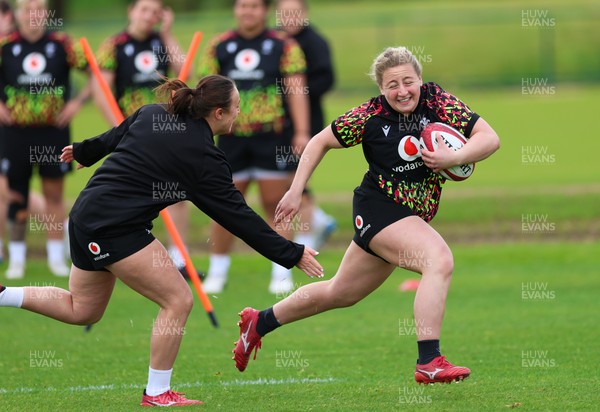 140526 - Wales Women Rugby Training - Molly Reardon warms up during a rugby training session ahead of their final Women’s 6 Nations match against Italy