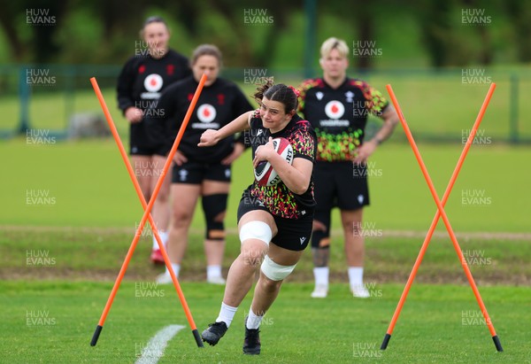 140526 - Wales Women Rugby Training - Branwen Metcalfe warms up during a rugby training session ahead of their final Women’s 6 Nations match against Italy