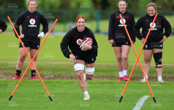 140526 - Wales Women Rugby Training - Georgia Evans warms up during a rugby training session ahead of their final Women’s 6 Nations match against Italy