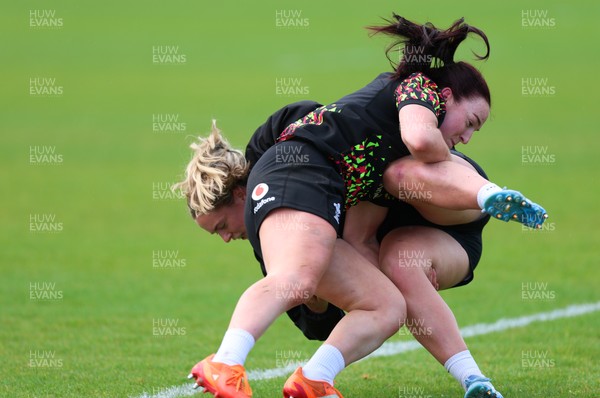 140526 - Wales Women Rugby Training - Freya Bell is tackled by Sian Jones during a rugby training session ahead of their final Women’s 6 Nations match against Italy