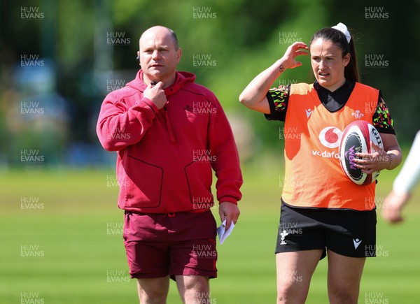 140526 - Wales Women Rugby Training - Sean Lynn, Wales Women head coach and Kayleigh Powell during a rugby training session ahead of their final Women’s 6 Nations match against Italy