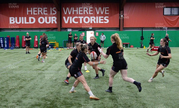 140923 - Wales Women Rugby Training Session - Niamh Terry passes to Cath Richards during training session