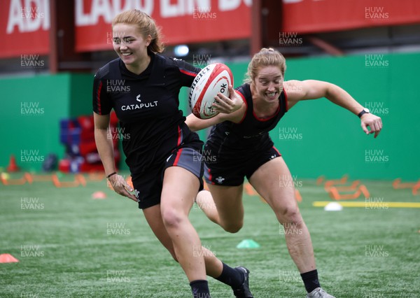 140923 - Wales Women Rugby Training Session - Niamh Terry gets past Lisa Neumann during training session