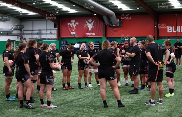 140923 - Wales Women Rugby Training Session - The forwards gather together during training session