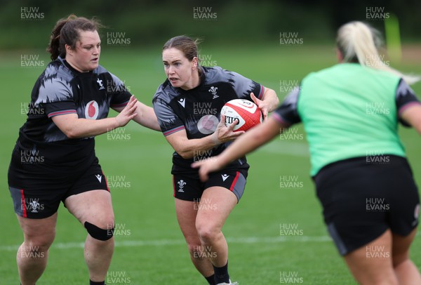 140923 - Wales Women Rugby Training Session - Kat Evans with Abbey Constable in support during training session