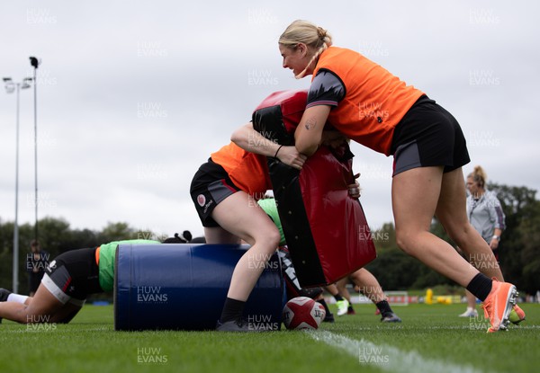140923 - Wales Women Rugby Training Session - Carys Williams-Morris holds off Cath Richards during training session