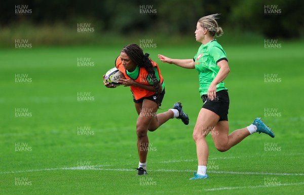 140926 Wales Women Rugby Training Session - Nia Fajeyisan takes on Amy Williams during a rugby training session ahead of the WXV matches against South Africa and USA