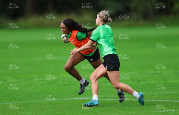 140926 Wales Women Rugby Training Session - Nia Fajeyisan takes on Amy Williams during a rugby training session ahead of the WXV matches against South Africa and USA