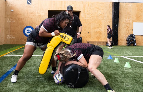141023 - Wales Women Training Session -  Sisilia Tuipulotu and Hannah Jones are watched by Ioan Cunningham during a rugby training session at the NZCIS in Wellington